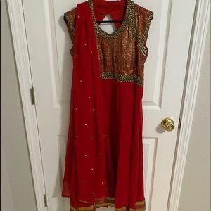 Red designer Anarkali with choodidar and dupatta.